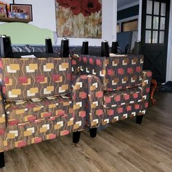 Designer chairs with foot stool.