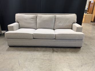 Grey Fabric Three-Seat Couch with Nailhead Trim