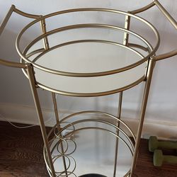 Gold wheeled bar cart