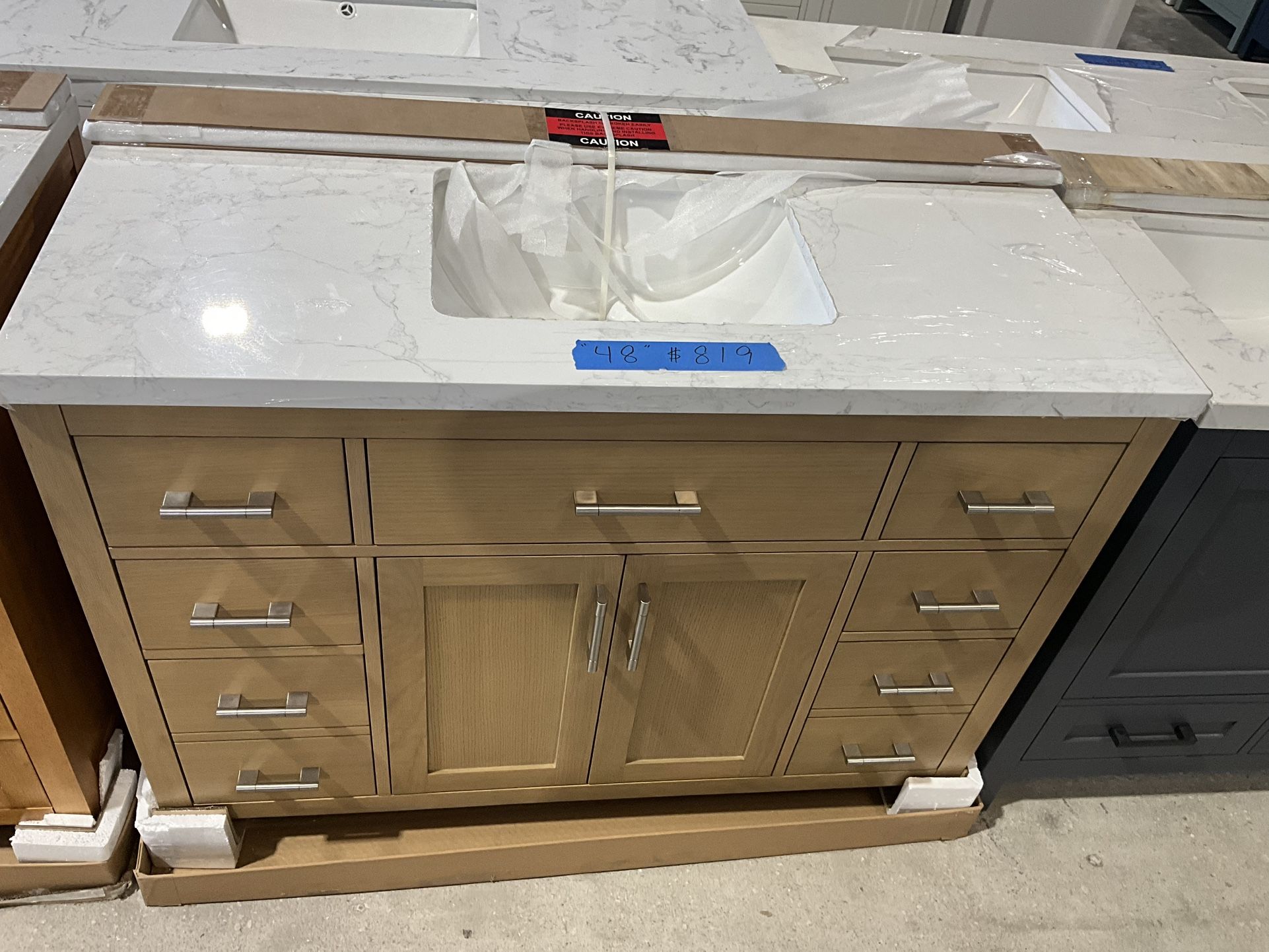 48” Bathroom Vanity in teak , single sink soft close solid wood with vanity top in white $819 Luke’s liquidations warehouse Address: 2434 N Forsyth
