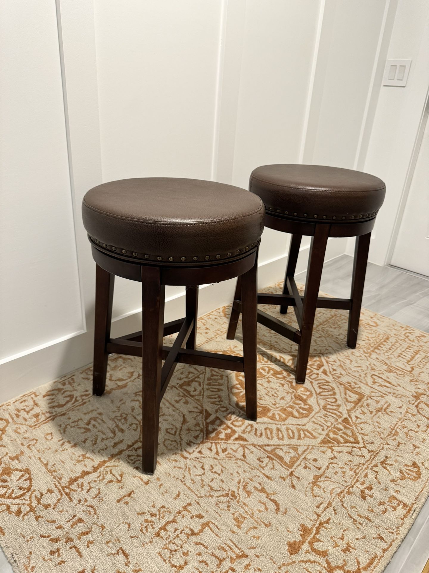 Set of Two Leather And Wood Swivel Barstools