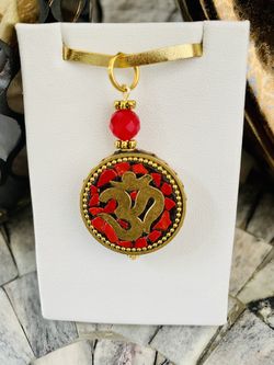 Om Pendant With Faceted Red Onyx