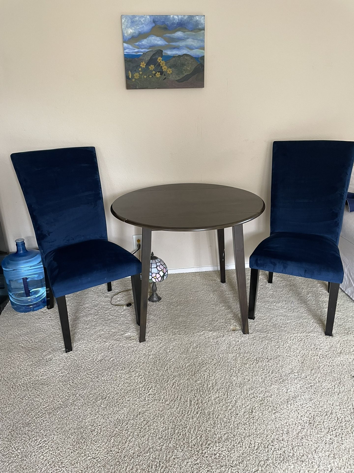 Circle Bistro Table and Two Blue Suede Chairs