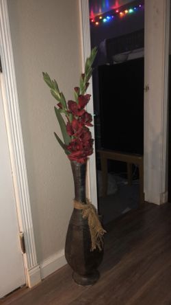 Faux flowers (gladiolus) and vase