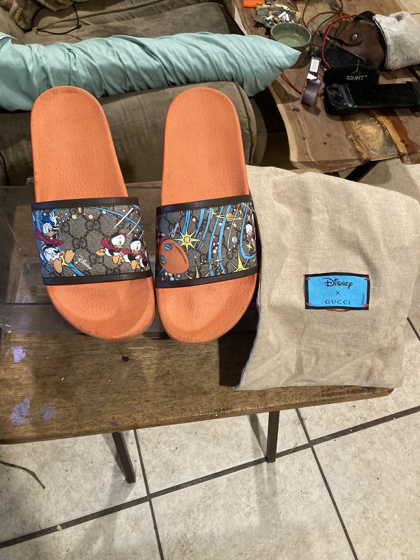 disney x gucci Donald Duck slides.