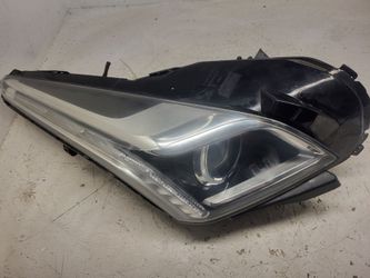 Cadillac CTS passenger side headlight assembly