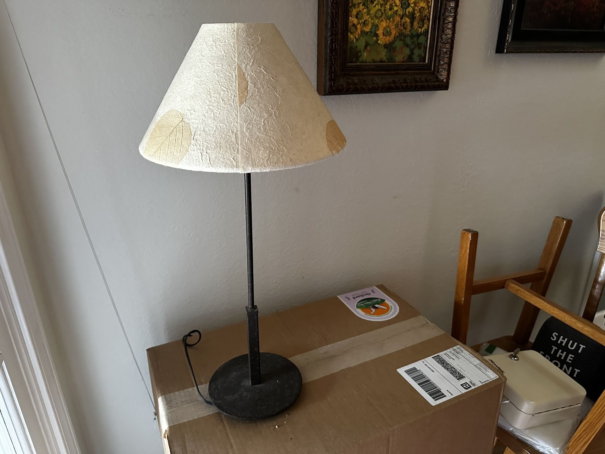 Vintage 21” tall dark bronze candle stick style table lamp with dried leaf shade.