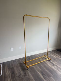 Gold Clothing Rack with Bottom Shelf