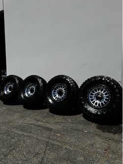 KMC KM552 IMS 6x135 17" Wheels With 35” Toyo R/T Pro Tires Machined with Black Lips
