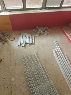 Closet brackets with hanging rods and shelves