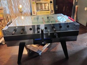 Foosball table coin operated