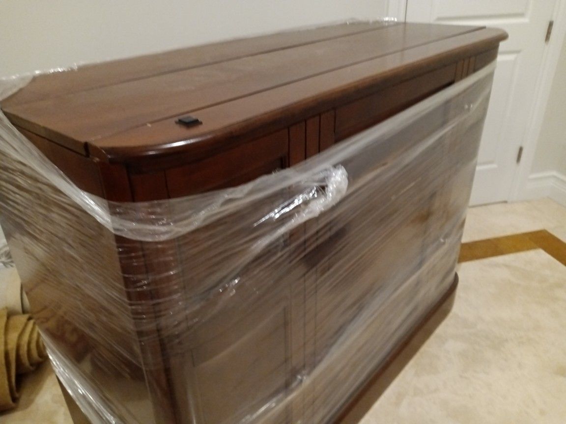 TV Wood console Cabinet holds Upto a. 42 Inch TV Measures 54 X 24 And Is 42 Inch Tall Power Switch Motor Operates TV Cabinet Up and Down