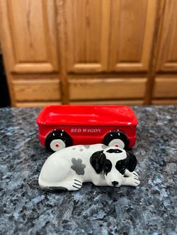 Vintage 1980’s Magnetic Red Wagon and Dog salt & pepper shakers. Size approximately 4 inches long and 2 inches tall. Brand new never used. The dog