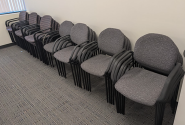 Stacking cushioned chairs x 28