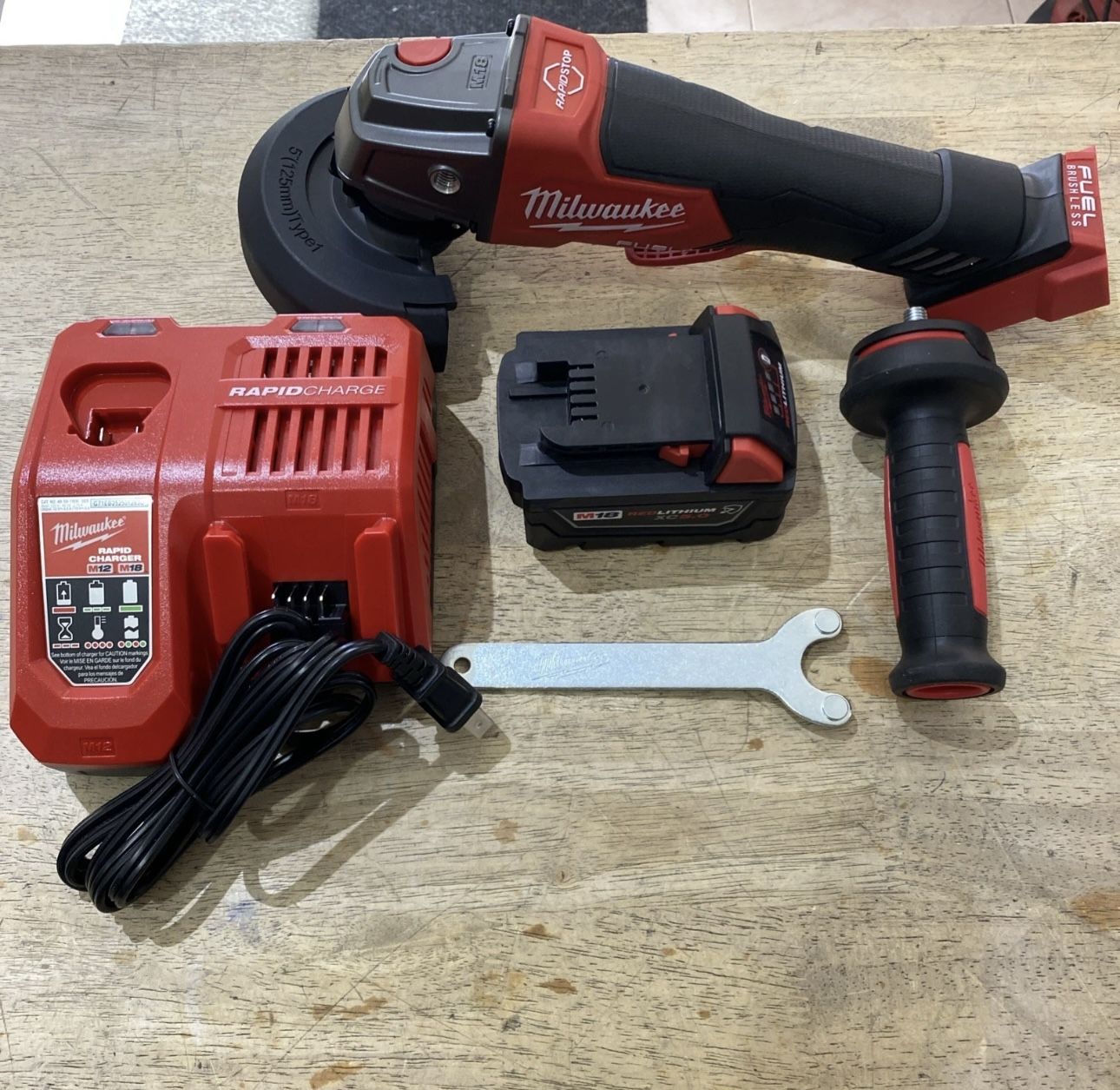 Milwaukee M18 FUEL 18V Lithium-Ion Brushless Cordless 4-1/2 in./5 in. Grinder with Paddle Switch with (1) 5.0 Ah Battery