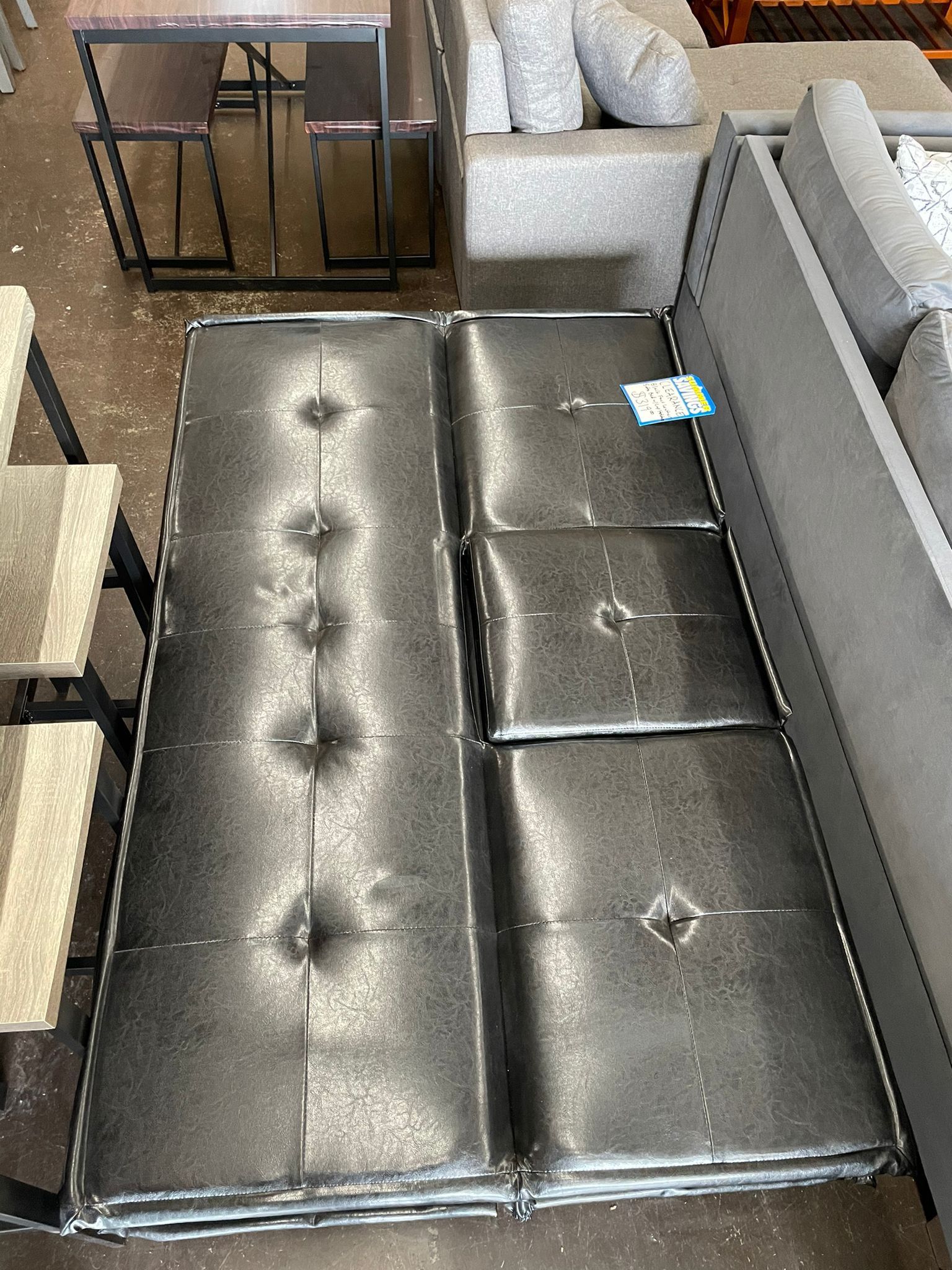 Black Leather Futon with Drop Down Console