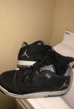 Black and gray Jordans 7 youth, gently used