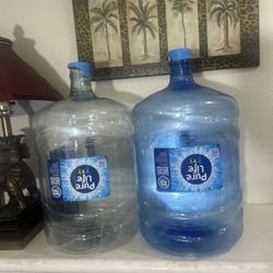 2 Recently Emptied 5 Gallon Water Bottles W/handles As Shown