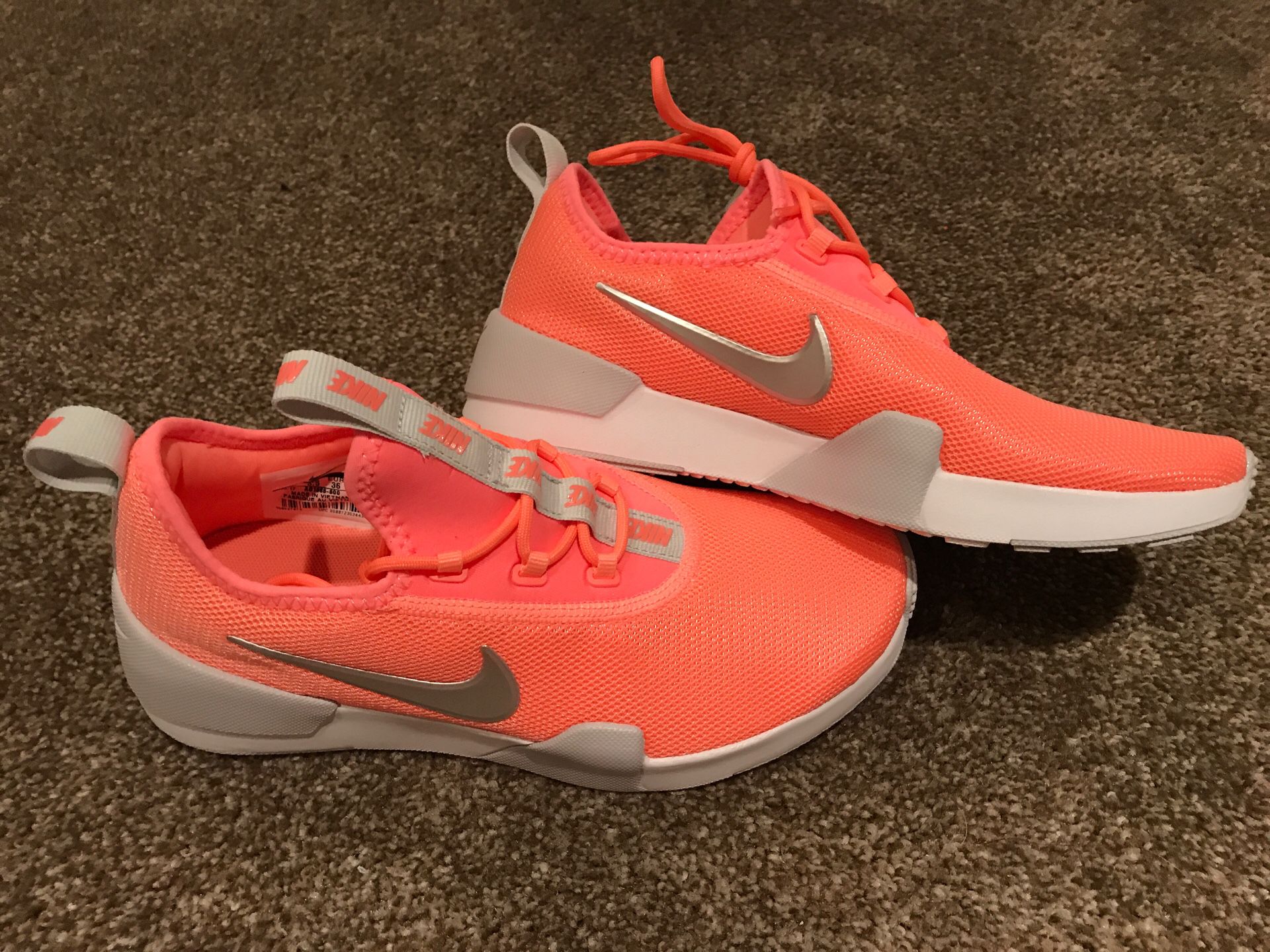 Peach Nike running shoes