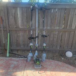 2 EGO 56V POWER LOAD HEAD TRIMMER AND 1 RAPID RELOAD HEAD TRIMMER WITH 5AH EGO BATTERY AND CHARGER 