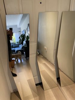 Dimensions: each mirror is 55 inches Dimensions: each mirror is 55 inches tall, 11.5 inches wide tall, 11.5 inches wide