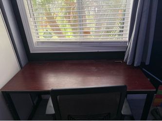 Brown desk with chair