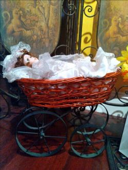 Porcelain Doll with Wicker stroller