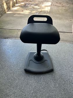 Adjustable height, black padded stool