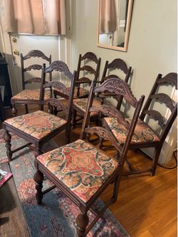 6  antique 19th-century French oak dining chairs featuring hand-carved details and upholstered seats