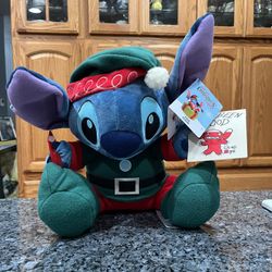 Plush Disney Parks Christmas Lilo & Stitch Holiday Stitch Plush Toy.  Size 14 inches tall.  Brand new with tags.  Smoke free home 