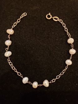 STERLING and freshwater pearl bracelet. Marked 925 and the initial MR. 7.5 in long. 9 pearls.
