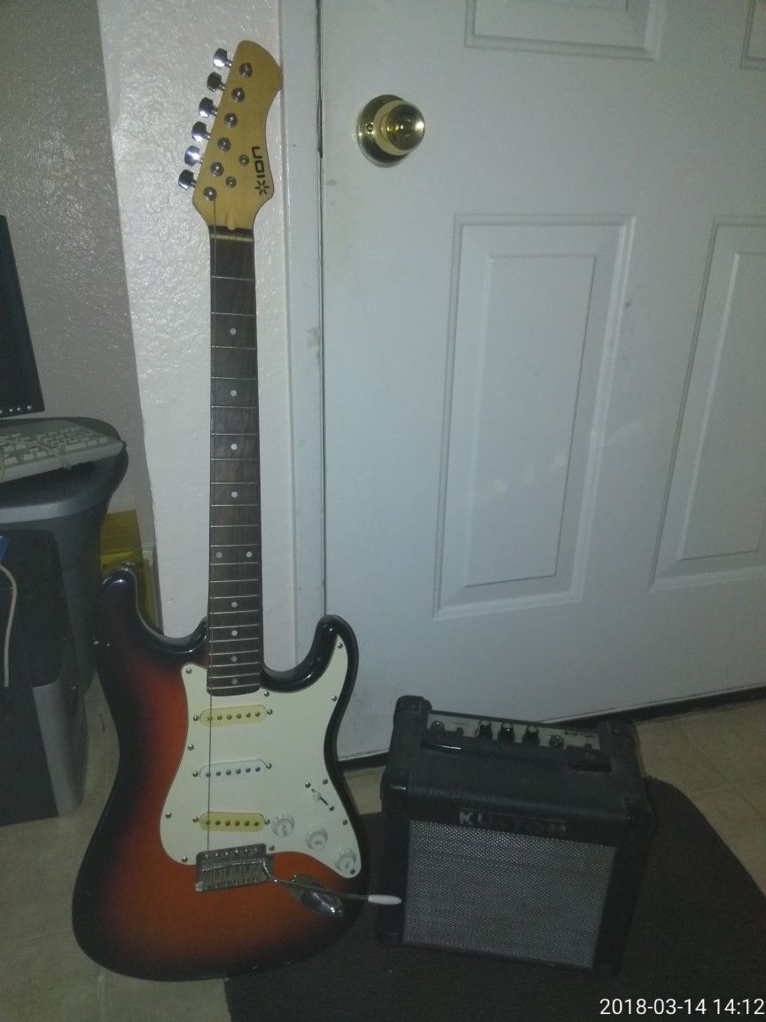 Uoi electric guitar with small amplifier works just needs new strings
