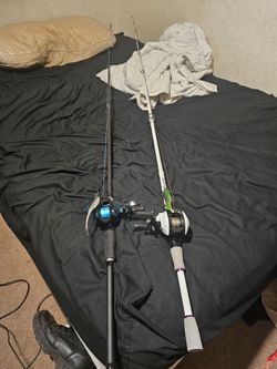 2 baitcaster fishing poles full spoiled with braid