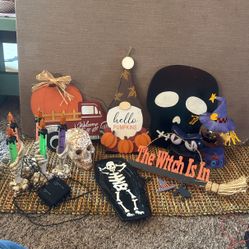 Assorted Halloween decorations skull is a bleeding skull lights flash take require 3 AA batteries witch light requires a lightbulb