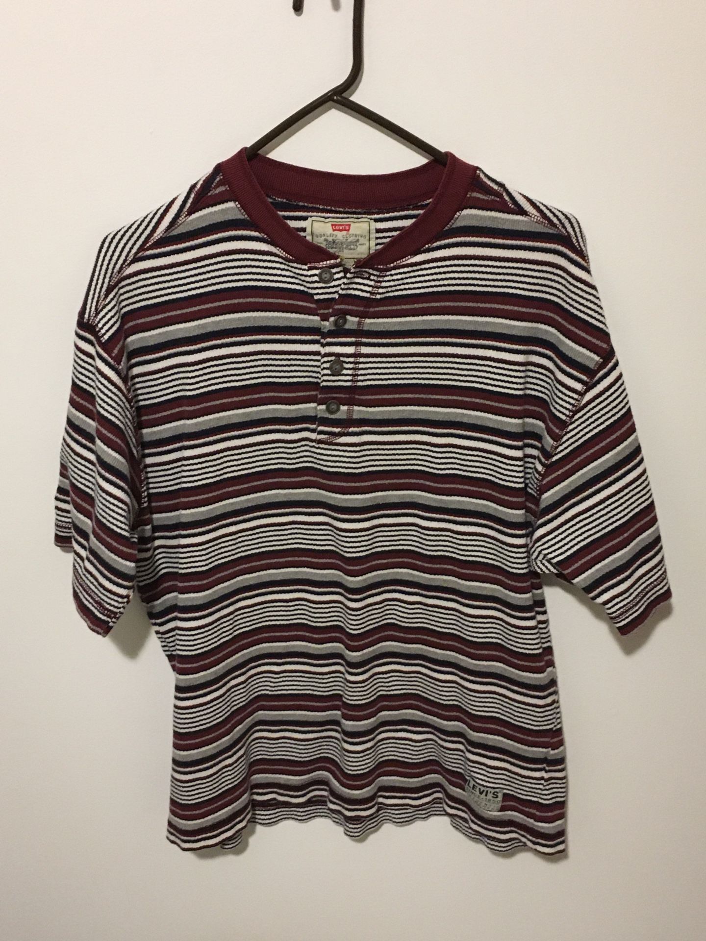 One Levi’s and one Docker shirt, size large.