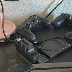 PS4 w/ 3 controllers, charging station, 1tb extra storage 