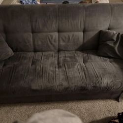 Gray Sleeper Couch With Two Pillows