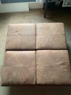 Brown leather ottoman