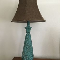 Teal Lamp Stand With A Brown Shade 