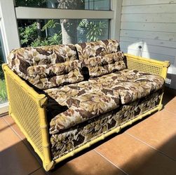 Vintage Rattan Loveseat with Floral Cushions