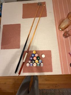 Billiard balls, cue stick and bridge