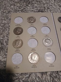 Incomplete kennedy half dollar coin book.