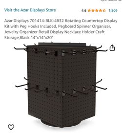 Rotating peg holder with pegs