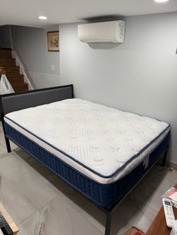 Queens sized bed with frame and mattress