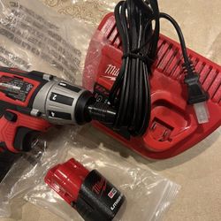 Milwaukee M12 Tool And Battery And Charger 