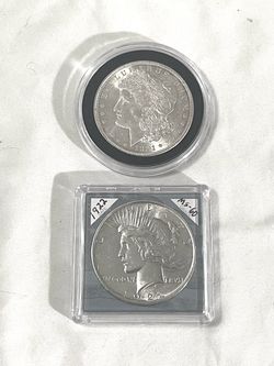 Uncirculated sealed in capsules 1921 and 1922 silver dollars. Valued $98 each.