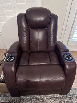 Two Brown leather reclining sofas and one reclining chair