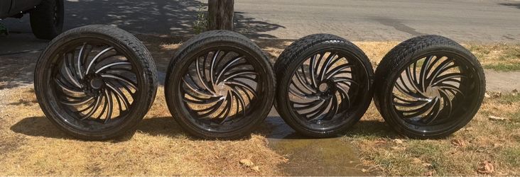 26 rims w tires - chrome  5/6 universal lug pattern