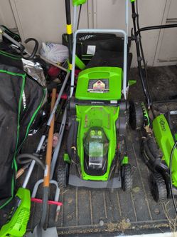 Green works lawn mower plus battery and charger
