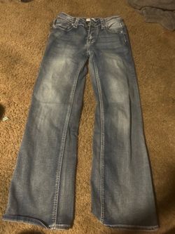 Girls open legged jeans.
